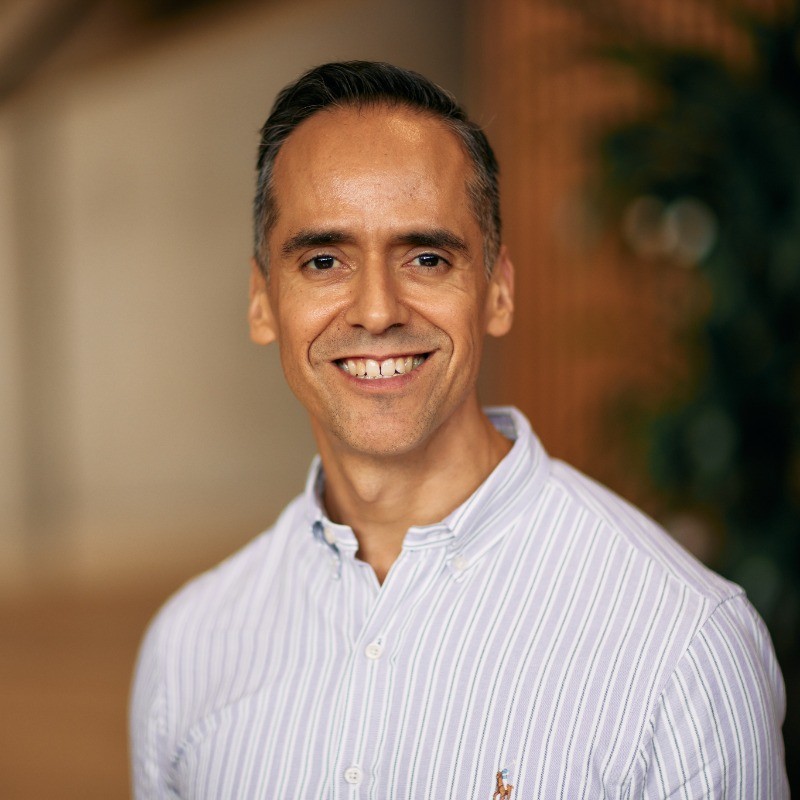 Rodolfo smiling into camera