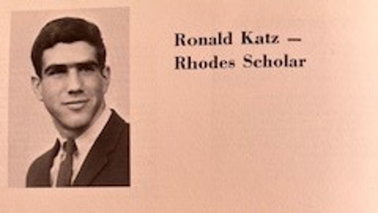 The picture shows a page out of a college yearbook, with a headshot of a young Ron and a large block of text under the heading 'Ronald Katz - Rhodes Scholar'