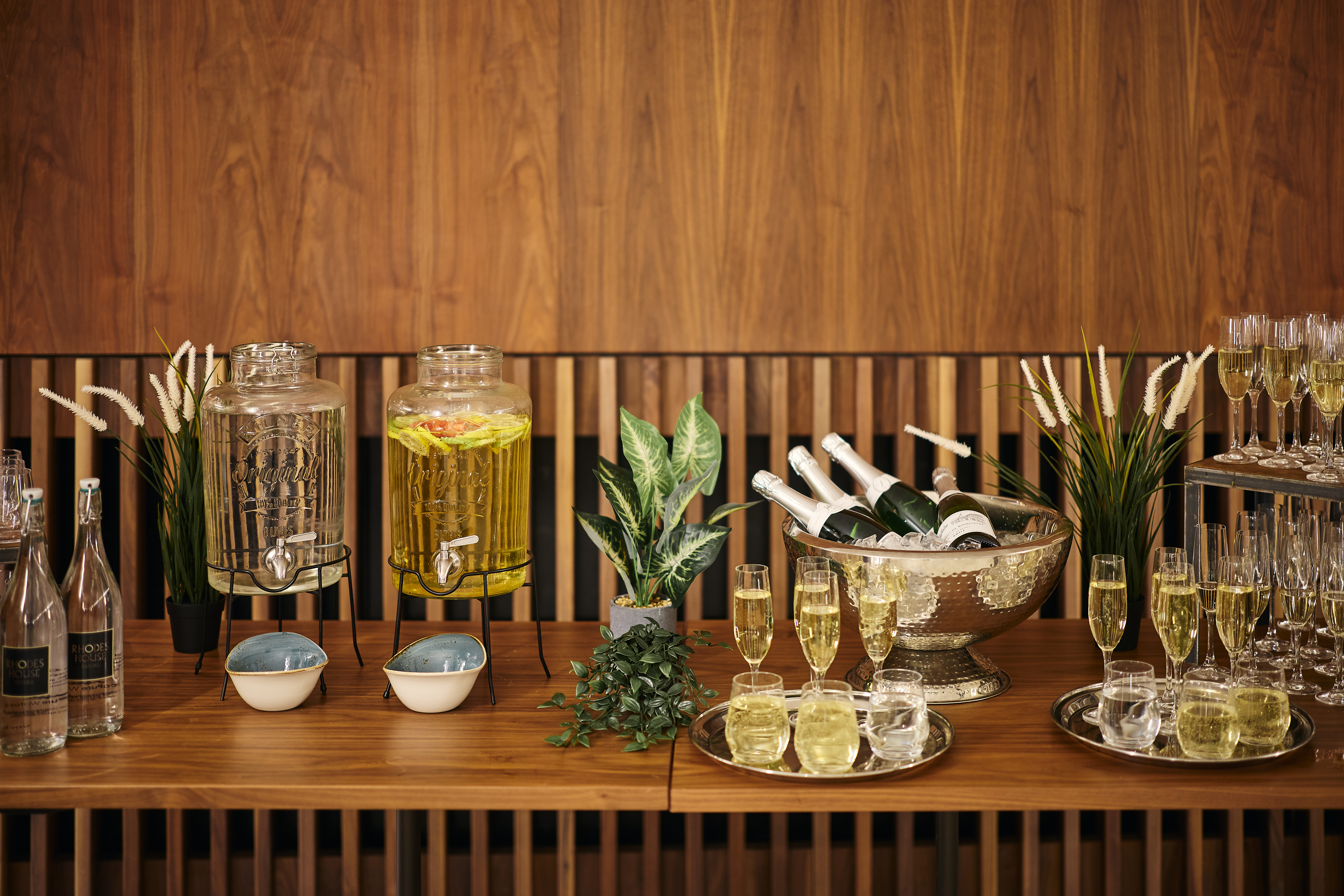Drinks set out on a service table for a drinks reception in the Conference Foyer.