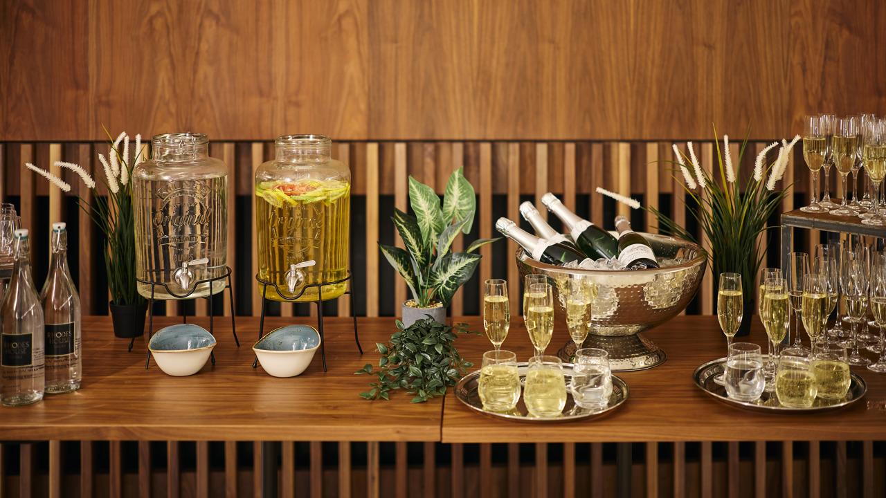 Drinks set out on a service table for a drinks reception in the Conference Foyer.