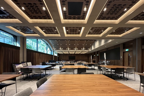 View from the side of the Conference Hall set up cabaret style with square tables.
