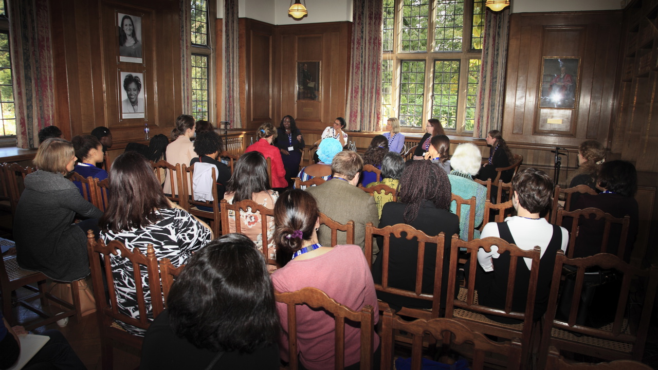 Talk in the Beit Room with guests facing a panel of seated speakers