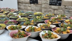 Bowl food set out for a standing delegate lunch.