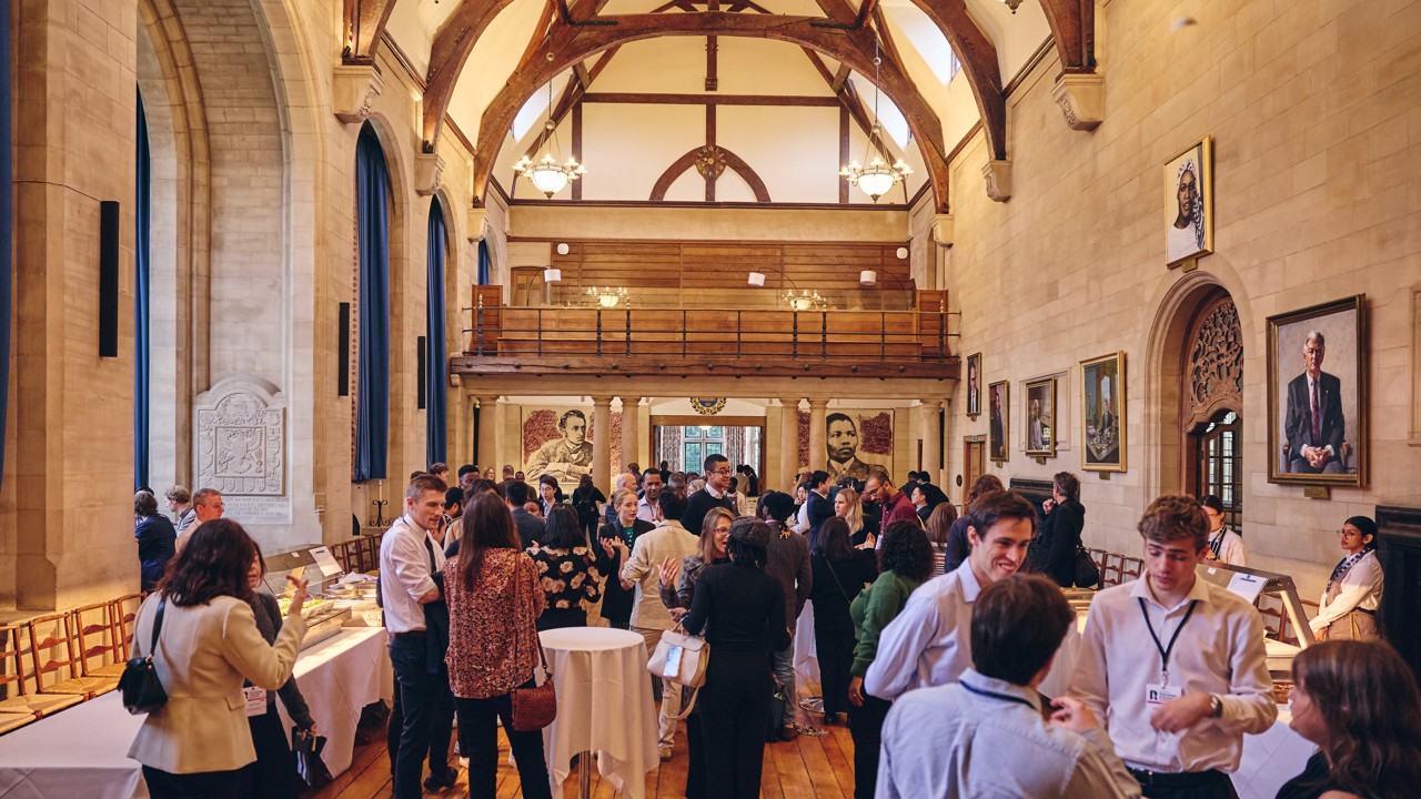 Drinks reception in McCall MacBain Hall with guests standing and mingling