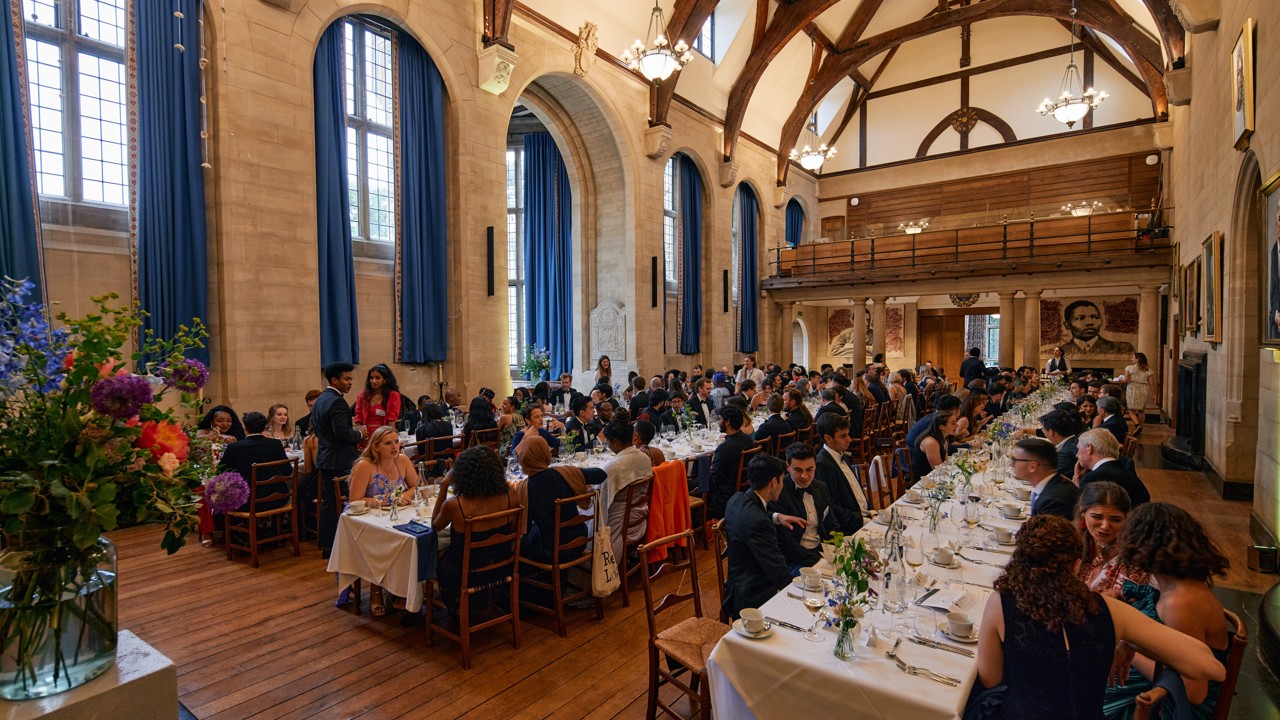 McCall MacBain Hall dining guests on long banquet tables