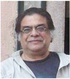 A picture of Jahar wearing round glasses and white hair on the sides.