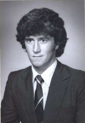 A black-and-white portrait of John