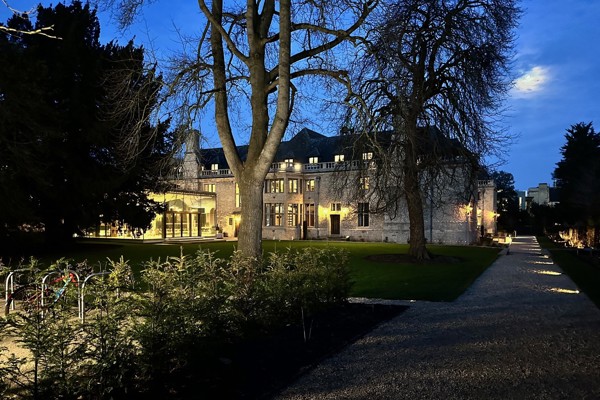 Rhodes House Glass Pavilion And Garden In the Evening with some bike racks in the foreground.