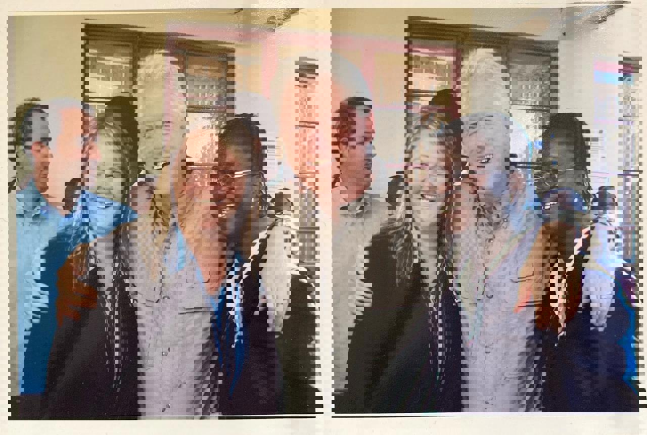 Bill Clinton with his arm around Rachel and another woman. All smiling.