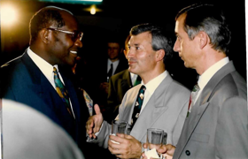 Richard and his partner in suits meeting with the Prime Minister of Ivory Coast who is also wearing a suit