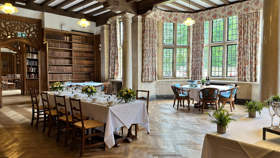 Tables set for formal meal in the Reception Room.