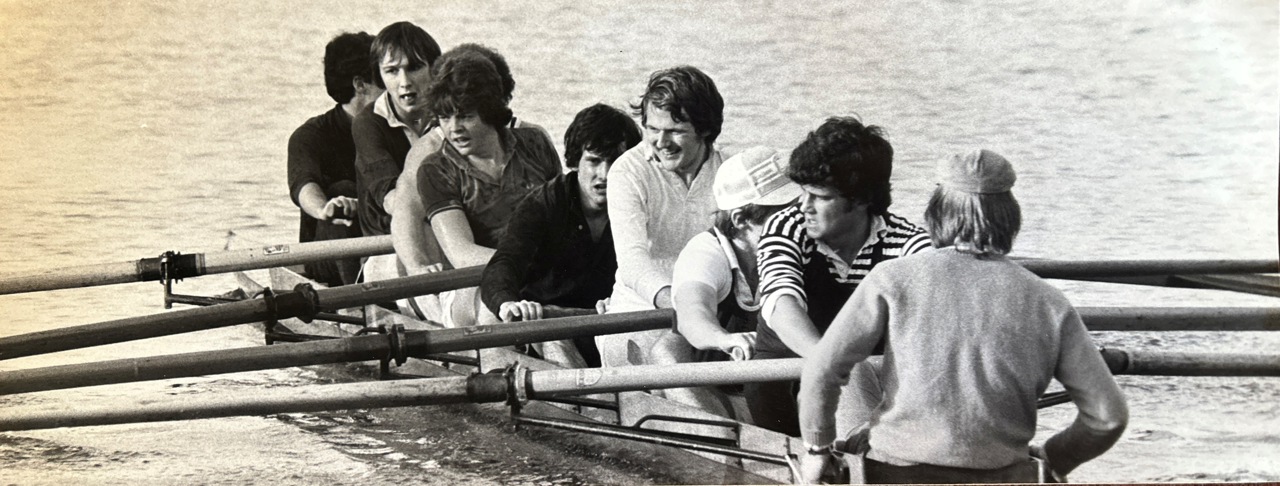 A black-and-white picture of a group of rowers.