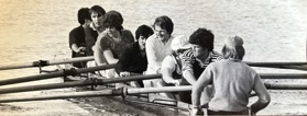 A black-and-white picture of a group of rowers.