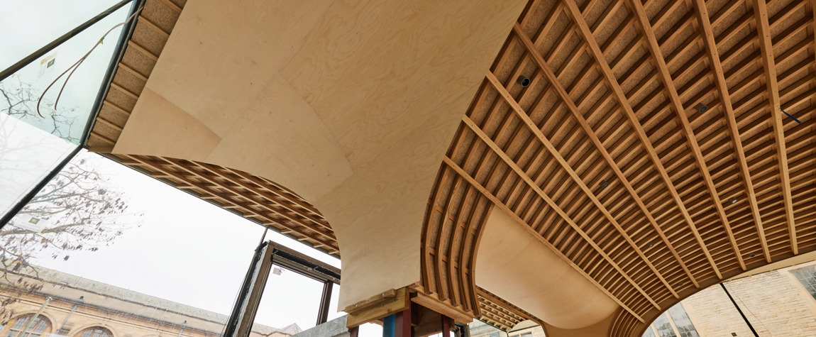 The arched roof of the Rhodes House garden pavilion under construction