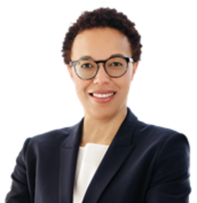 Photo of Inosi Nyatta in a suit and glasses smiling