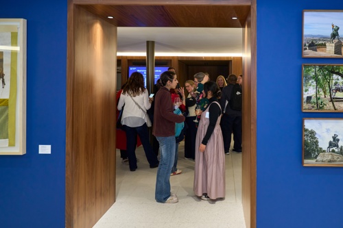 A glimpse into the convening space at Rhodes House where people are mingling