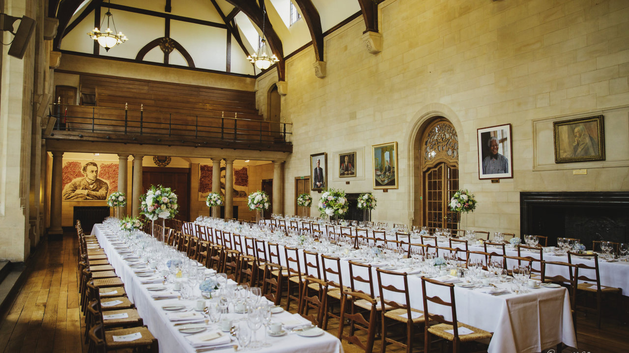 McCall MacBain Hall Wedding Banquet Tables with white flowers courtesy of Gemma Williams Photography