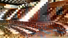 Chairs in a curved arch layout in the Beit Room