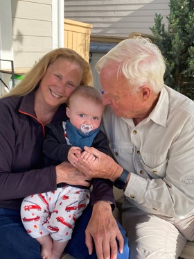 The picture shows Richard and another woman holding a baby.