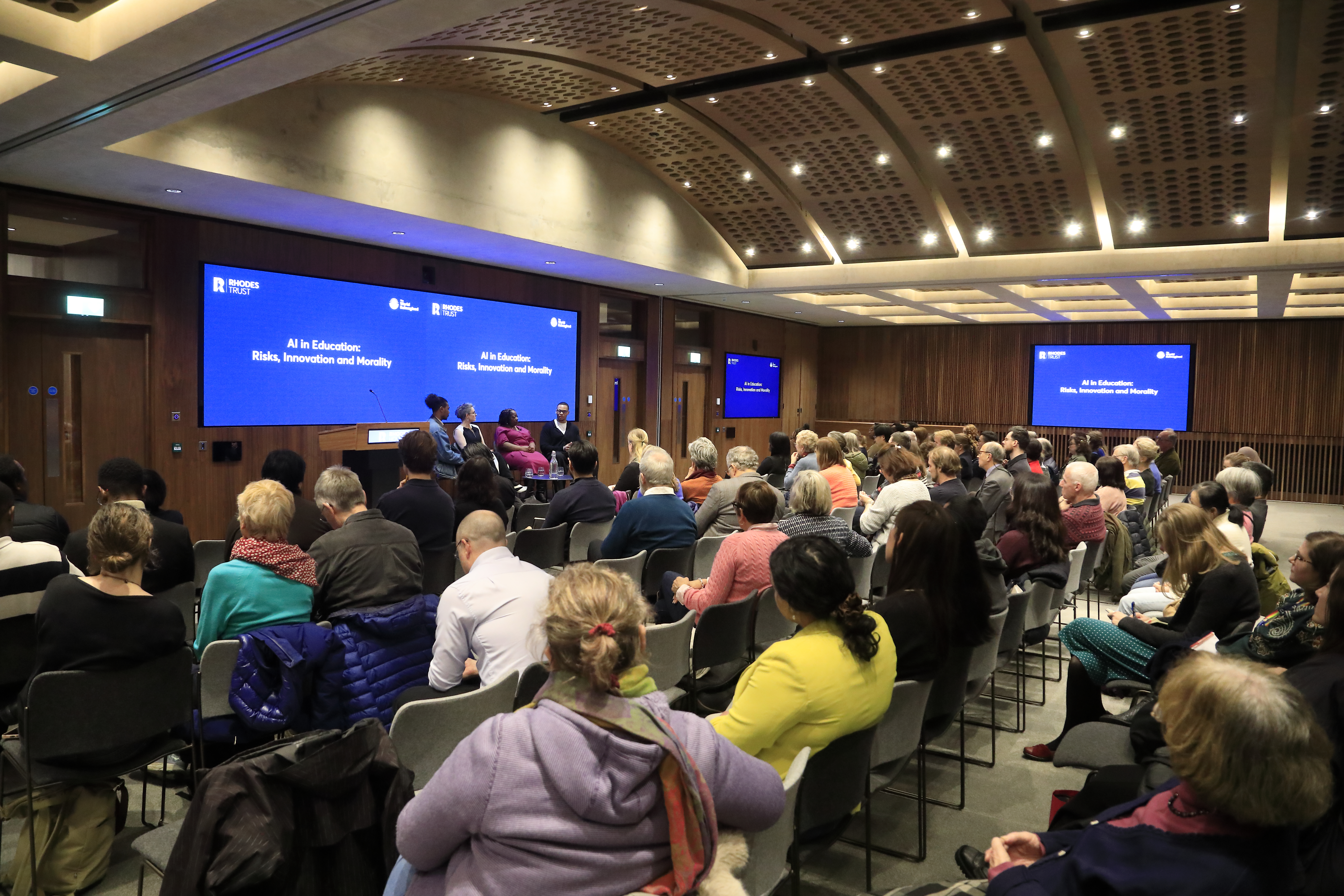 The panel and audience viewed from the side