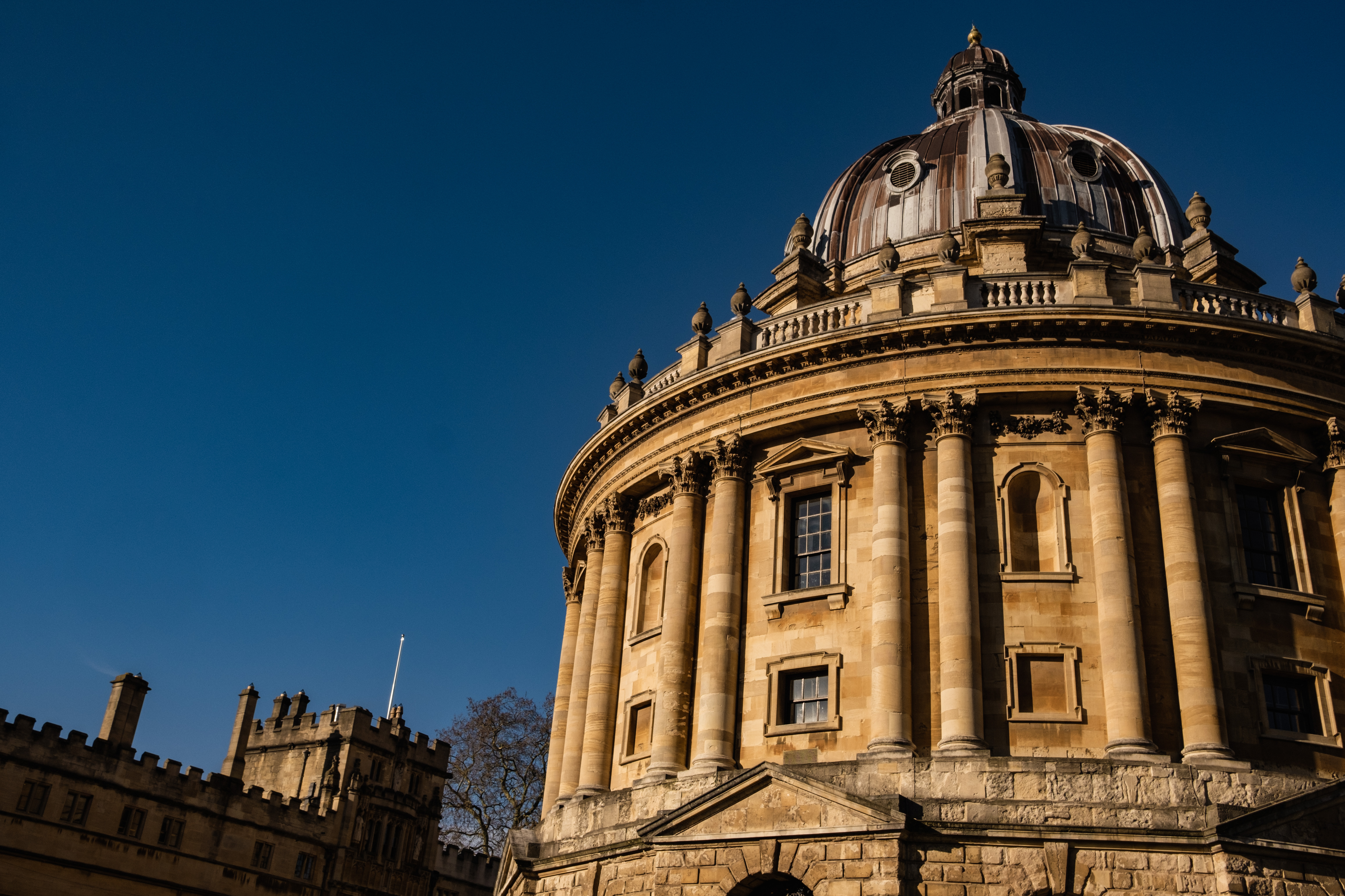 The Radcliffe Camera in Oxford, imposing against the sunshine and blue skies.