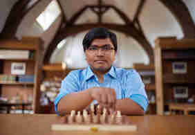 A Scholar playing chess at Rhodes House