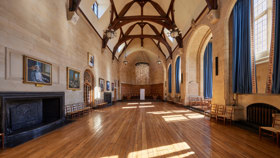 McCall MacBain hall at Rhodes House with the 'Floating Garden' sculpture suspended from the ceiling at the far end.
