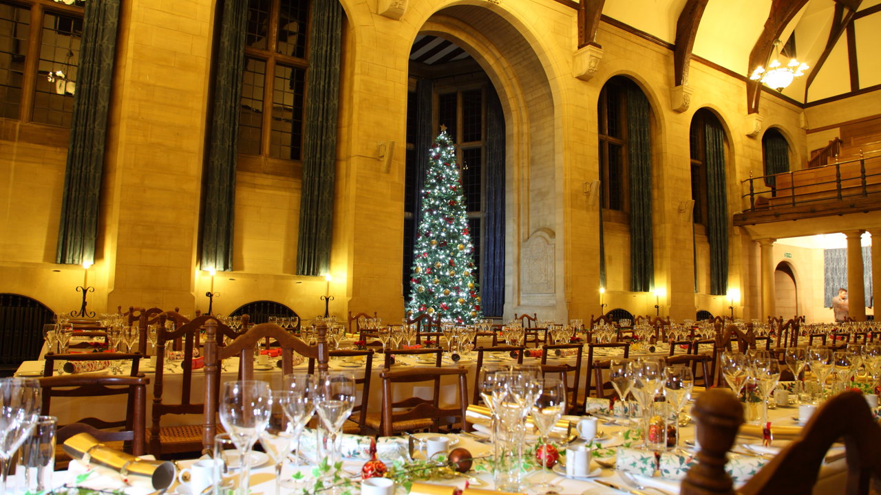 McCall MacBain Hall Christmas tree and dining tables set for Christmas party.
