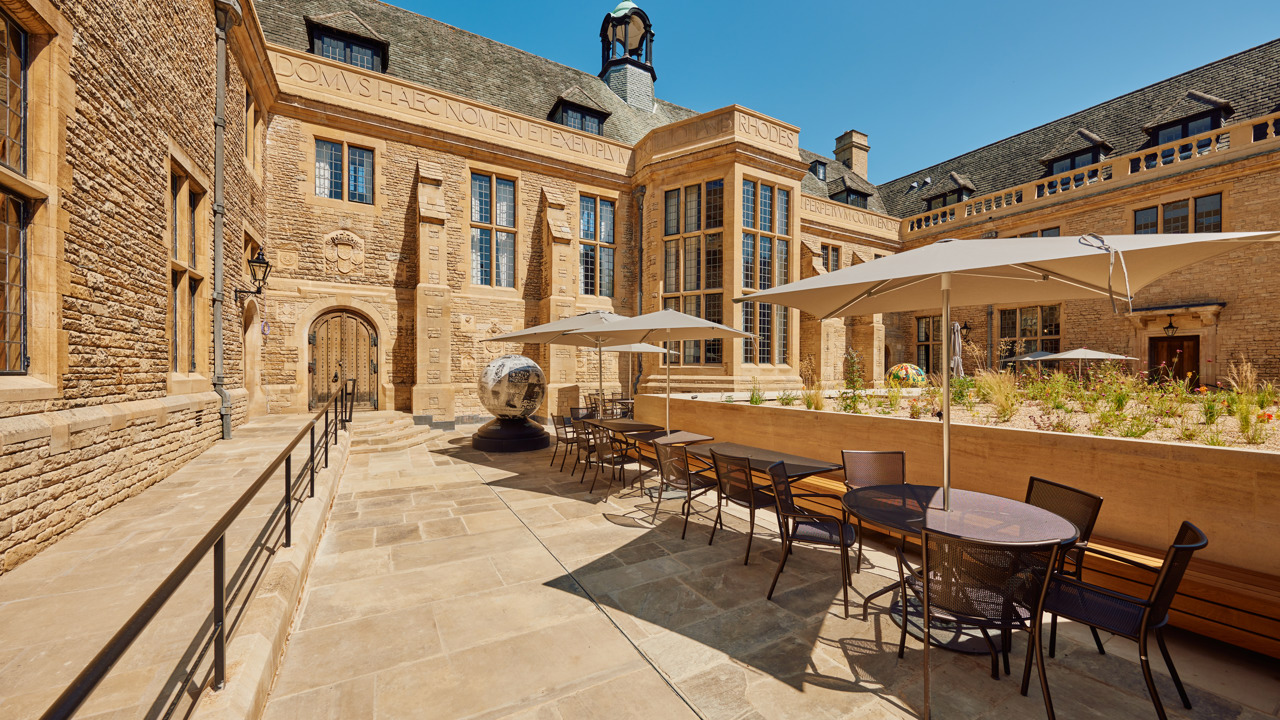 Tables And Sunshades In The Rhodes House Courtyard