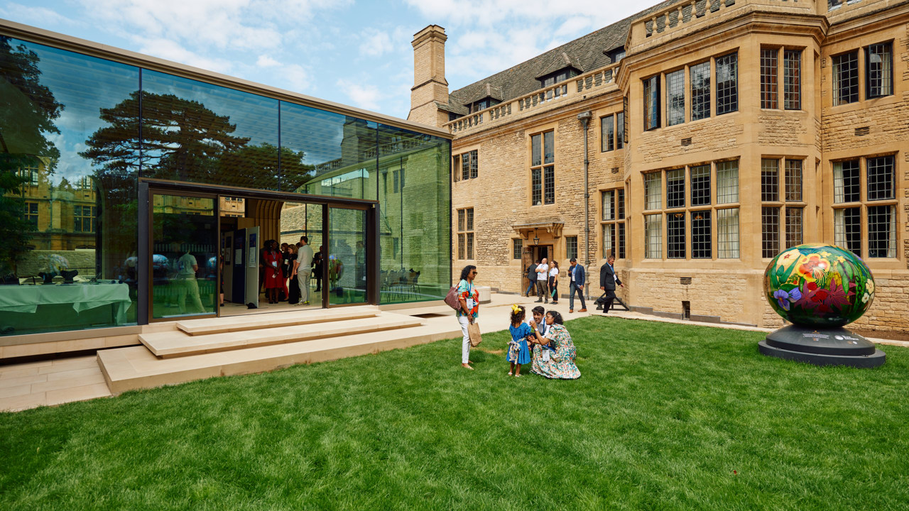Guests on the Rhodes House West Lawn in front of the Glass Pavilion