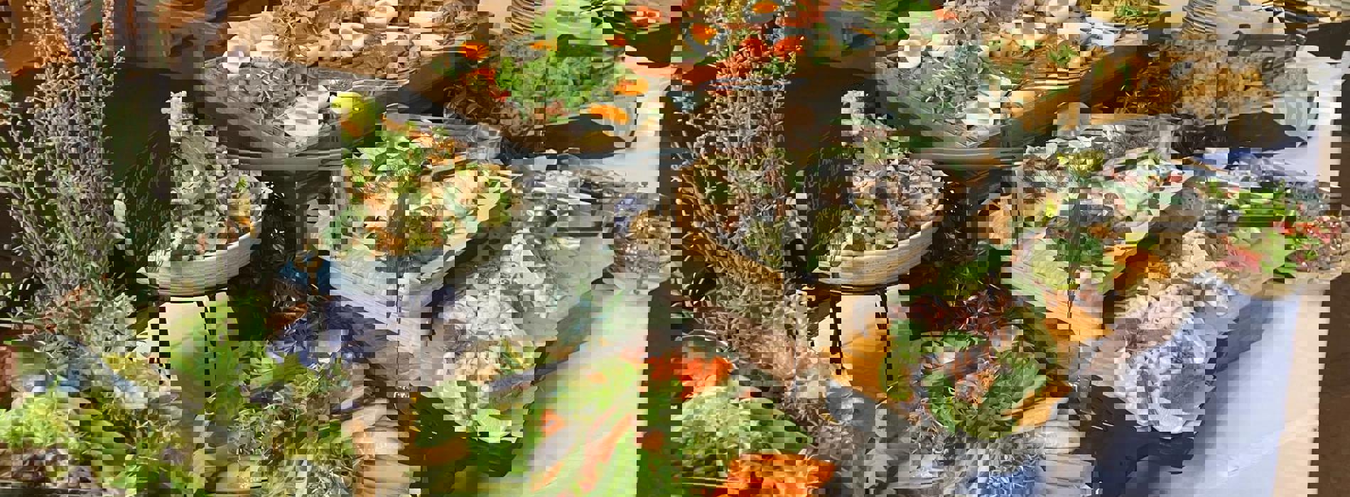 Food set out for a buffet lunch.