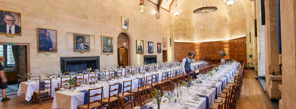 A Single Waiter Setting Places In Mccall Macbain Hall