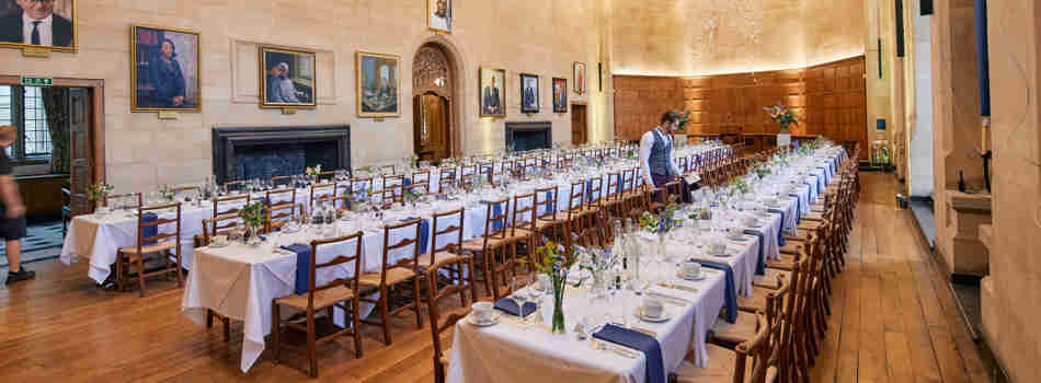 A Single Waiter Setting Places In Mccall Macbain Hall