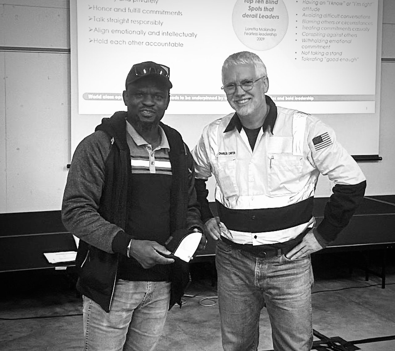 Charles standing with another man
