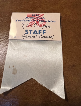 Silver staff badge.