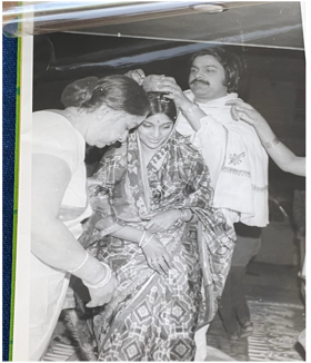 A black-and-white picture showing Jahar and Sunita's wedding, 1972, Delhi. Sunita is being anointed with red “sindoor powder” in hair-parting in a traditional custom.