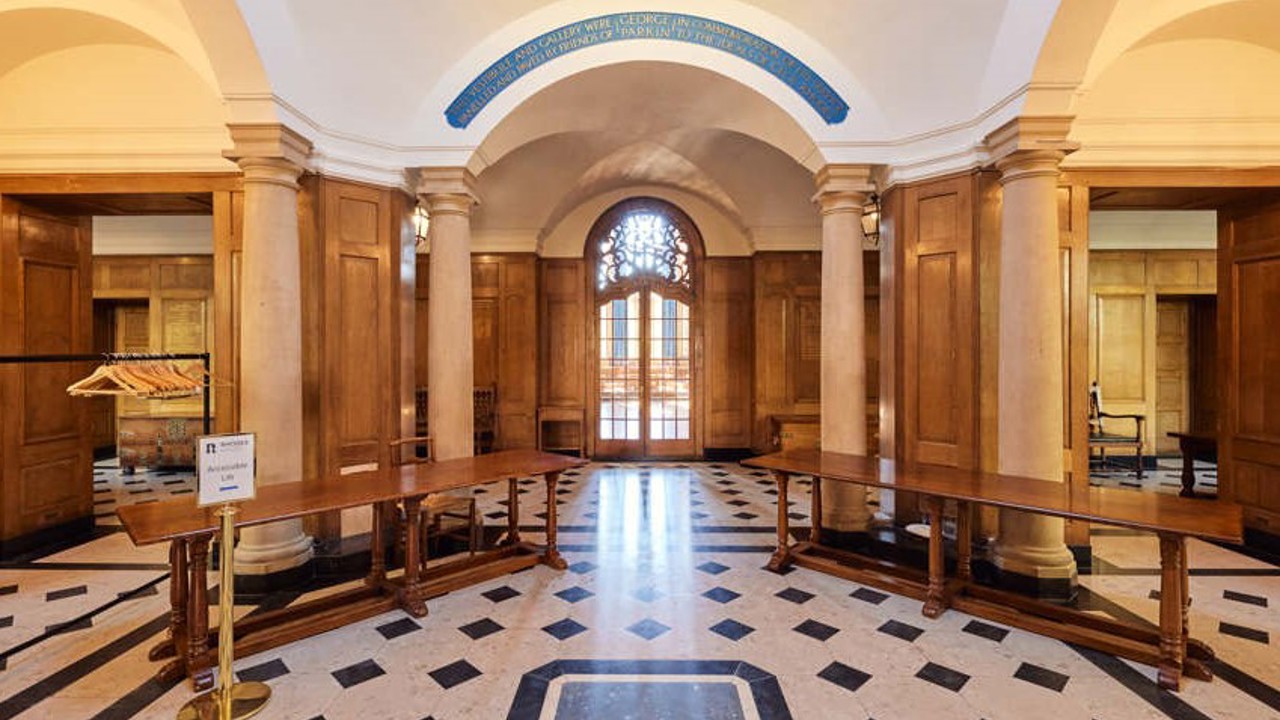 Parkin Vestibule with two registration tables and the entrance to McCall MacBain Hall in the background.