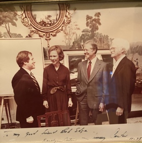 Bob with Rosalynn and Jimmy Carter and another man, dressed in formal attire and surrounded by nature paintings